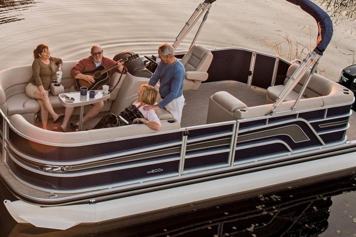 a group of people on a boat in the water